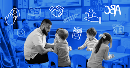 Children sitting at table with teacher in preschool